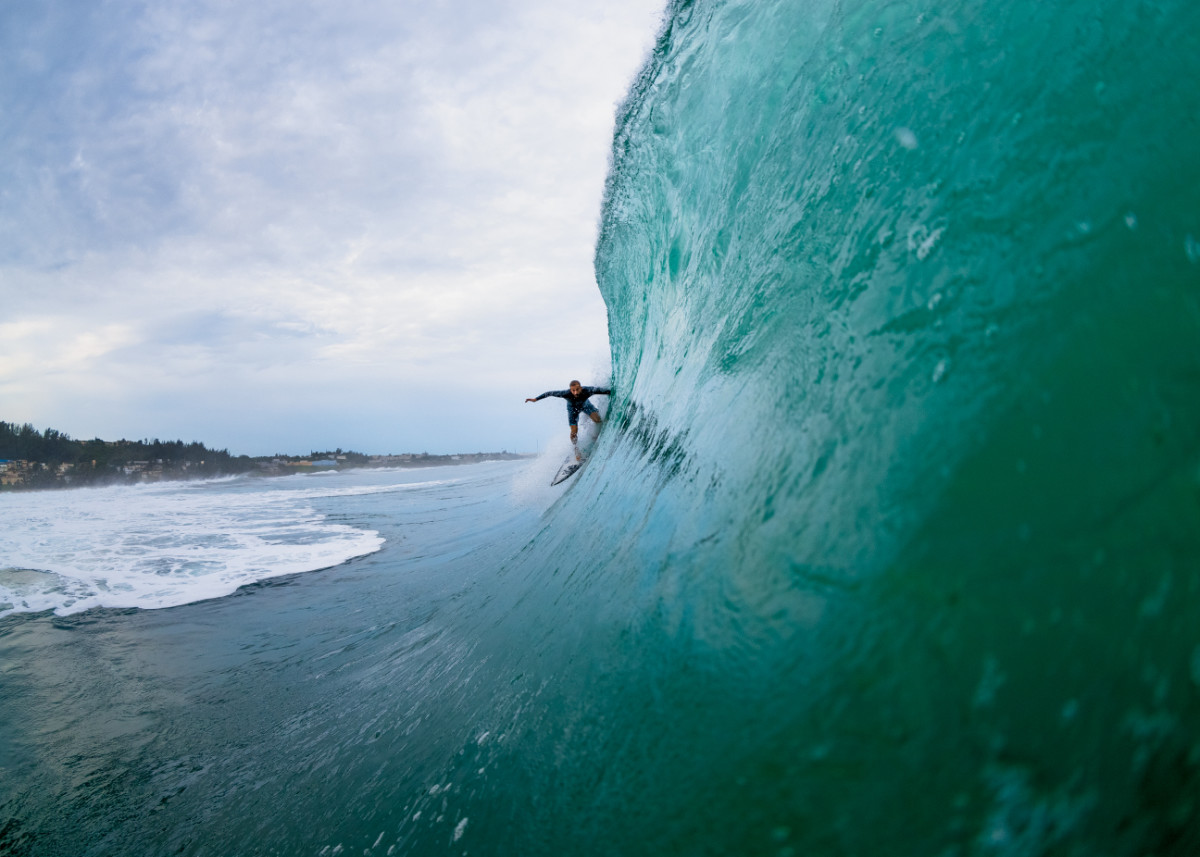 Gaby Escudero, seen here sliding into one of Puerto Rico’s best-kept secrets, has lent a helping hand in trying spread awareness about the Columbus Landing Resort, and what it will do to the land that fronts four popular surf breaks on the northwestern tip of the island. Photo: Craig