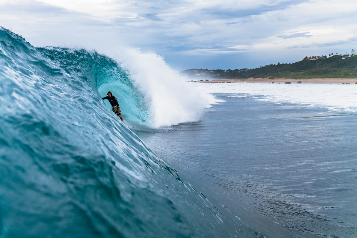A few weeks before the Columbus Landing protest, Hurricanes Matthew and Nicole lit up the northern shores of Puerto Rico with amazing surf. “Middles was like Off The Wall during those hurricanes,” says Dylan Graves, pictured here stalling in a very Hawaiian-looking cavern. “It had such a long period—I think it was 6 feet at 16 seconds. And it had so much energy in it. When I was looking at it from my house in the morning, I could see corduroy lines to the horizon. We rarely get stuff like that.” Photo: Craig