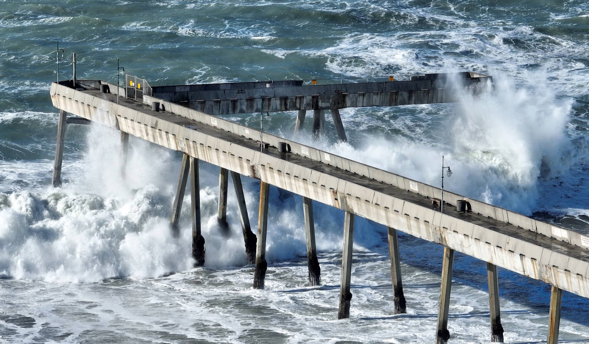 Massive Waves Annihilate Iconic NorCal Pier (Video) - Surfer