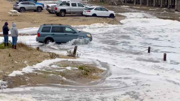 outer banks, north carolina flooded by high surf brett barley