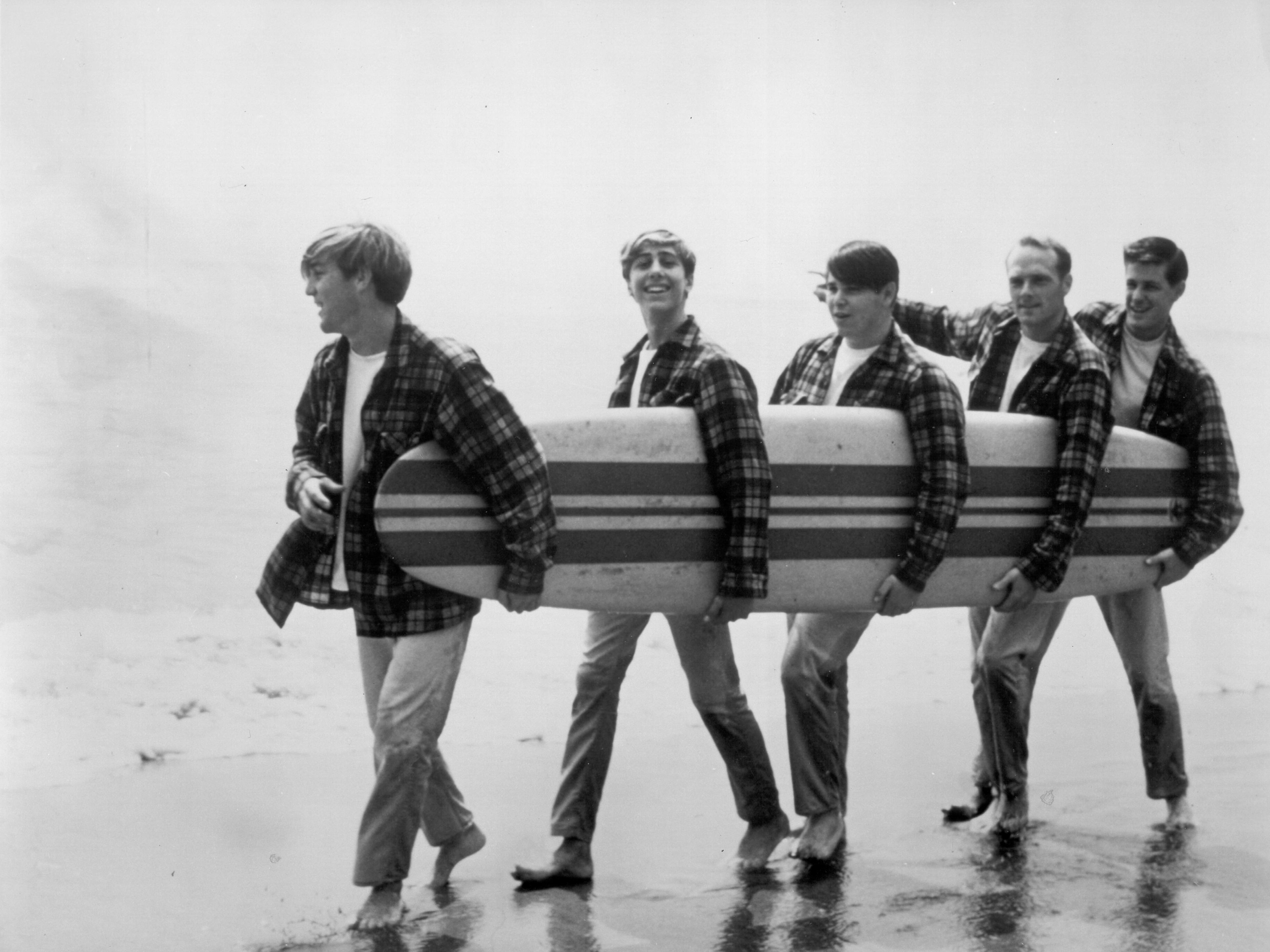 The Beach Boys during a photoshoot for their debut album, 'Surfin' Safari', Los Angeles, 1962. Left to right: Dennis Wilson, David Marks, Carl Wilson, Mike Love and Brian Wilson.