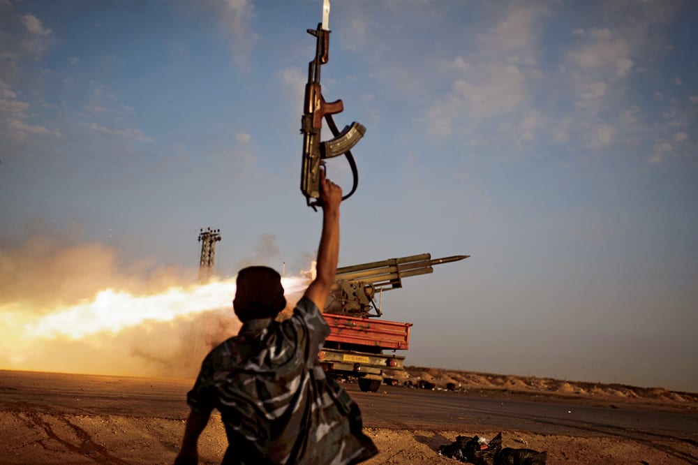 Libya, March 2011. A rebel fighter launches missiles into pro-Gaddafi lines. ‘It probably took me three days of travel to photograph this moment,’ says Cervera. ‘It’s like chasing a swell. You have to wait for just the right situation.’ Photo: Cervera

