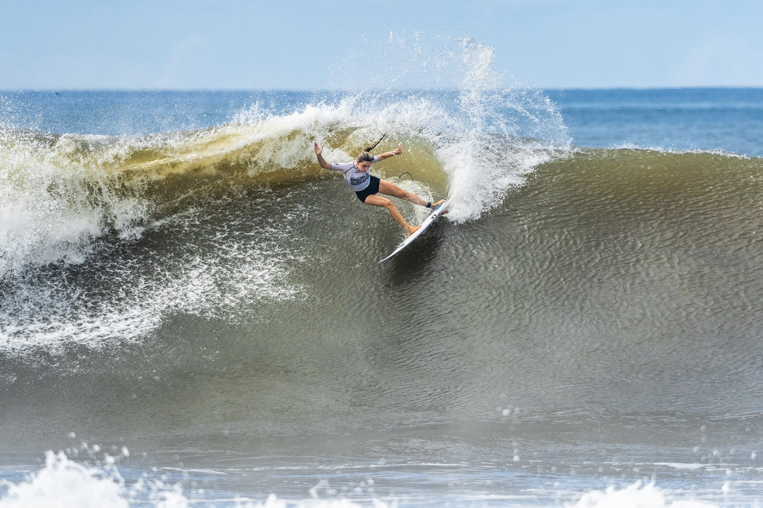 Spanish surfer Janire Etxabarri leans into a wave in El Salvador.